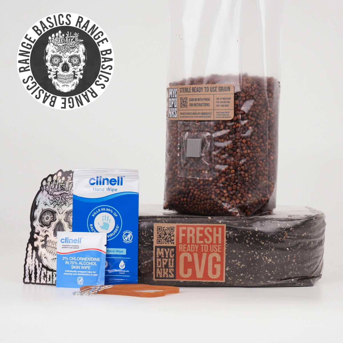 Close up of the contents of MycoPunks Basics Grow Kit, which is one Clinell hand wipe, one clinell alcohol wipe, a sticker, two paperclips, an elastic band, one MycoPunks ready-to-use CVG, and one MycoPunks Sterile Milo grain